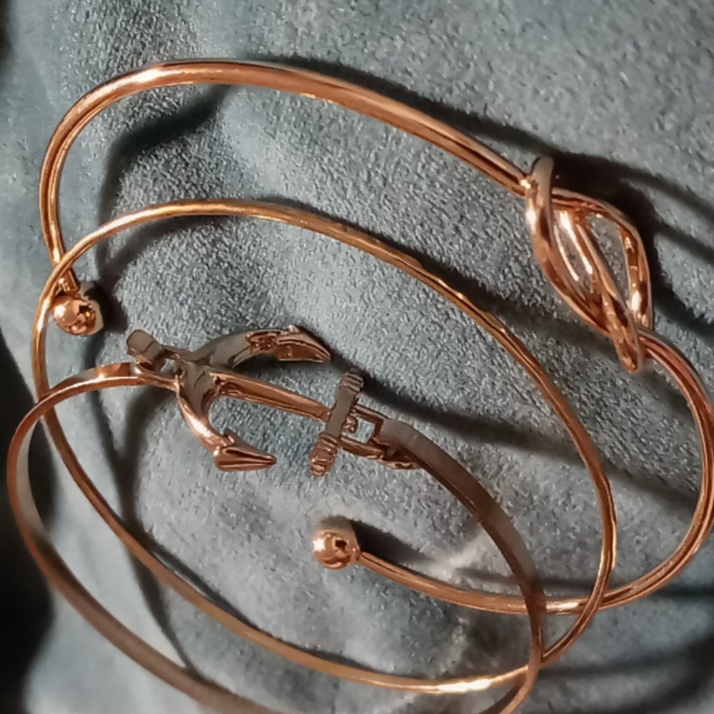 Knot cuff style bracelet & anchor 1 bangle gold tone all three.